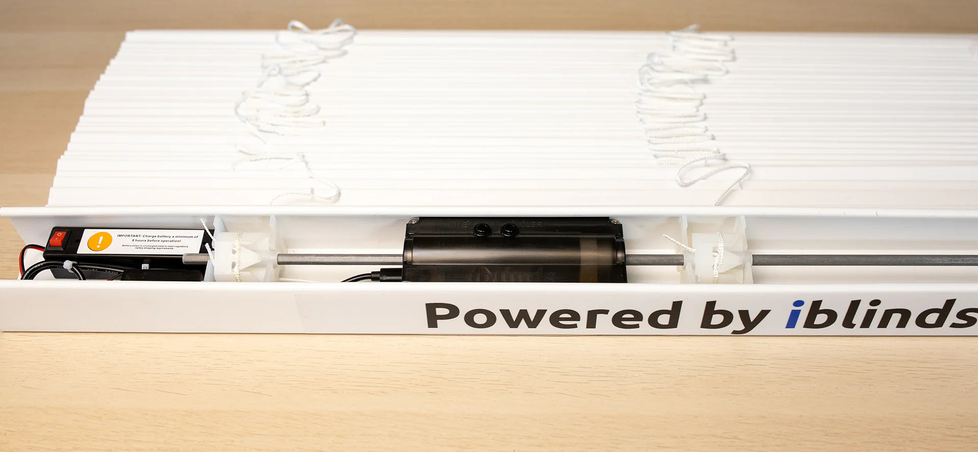 iBlinds motor installed inside a horizontal blind headrail